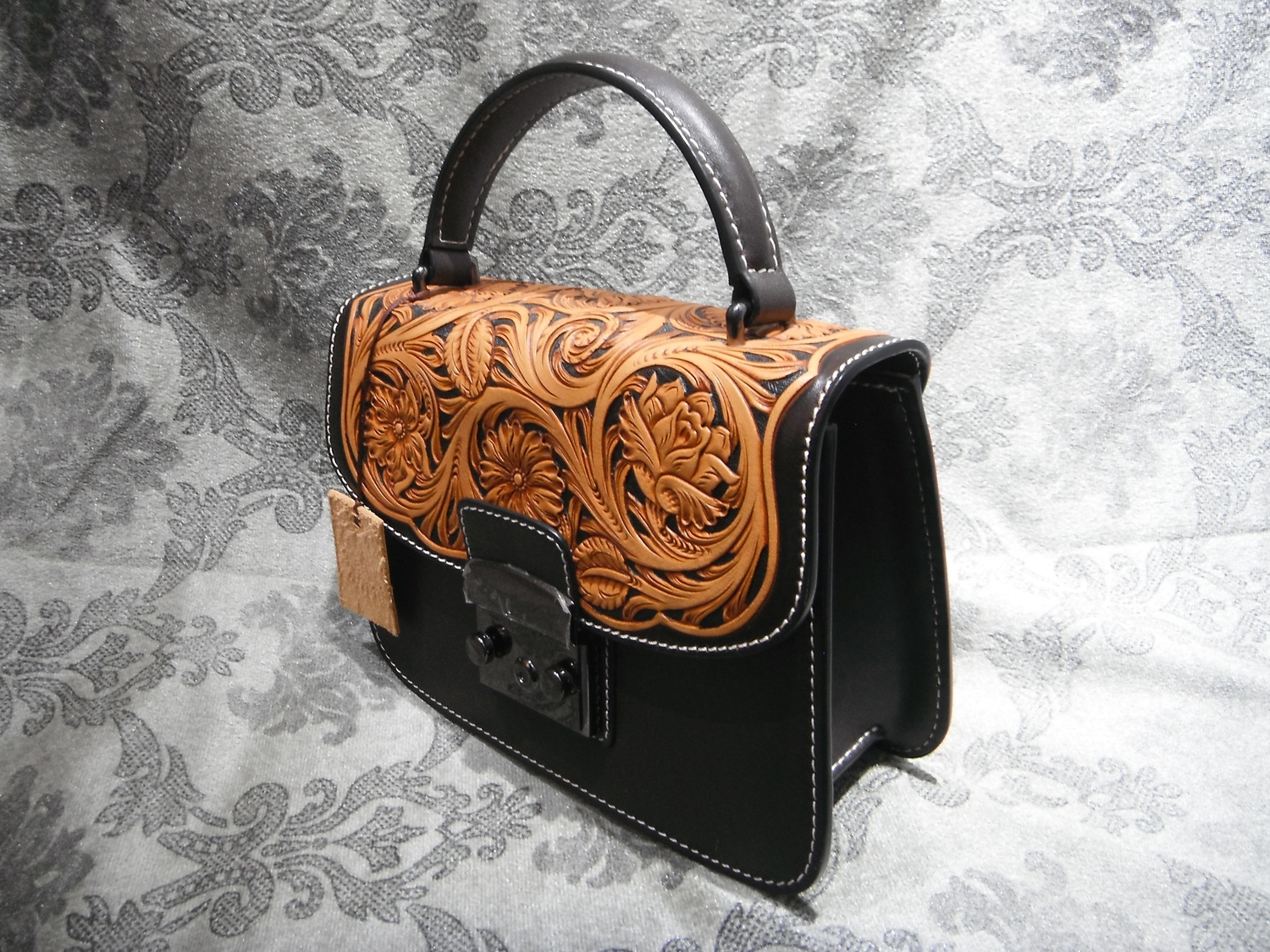 <p>Yu Family Ornately Carved Leather Handbag&nbsp;</p>